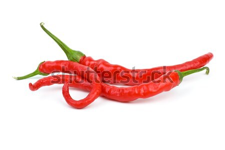 Three long curved red hot chili peppers Stock photo © digitalr
