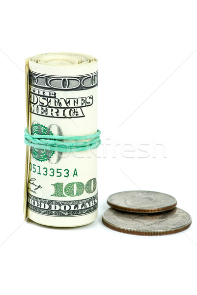Roll of $100 banknotes tightened with rubber band and two coins Stock photo © digitalr