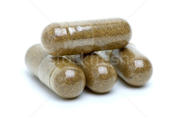 Cuatro marrón homeopáticos pastillas aislado blanco Foto stock © digitalr