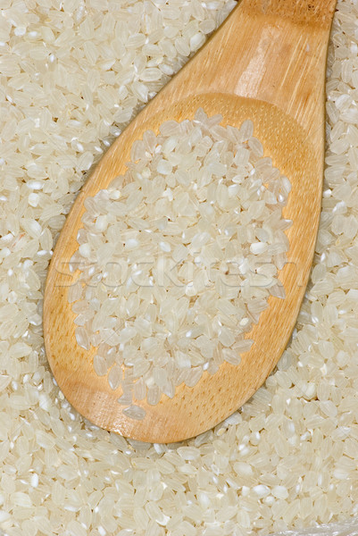Wooden spoon with uncooked polished rice Stock photo © digitalr