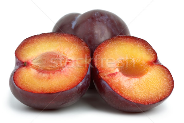 Violet plums: whole and two halves Stock photo © digitalr