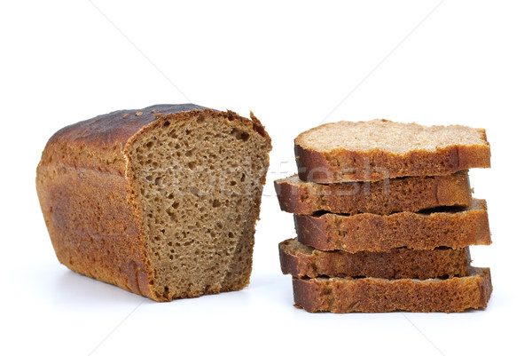 Chunk of rye bread with anise and some slices Stock photo © digitalr