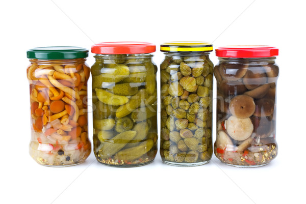 Glass jars with marinated cornichons, mushrooms and capers Stock photo © digitalr