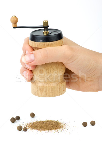 Wooden spice handmill in hand and allspice  Stock photo © digitalr