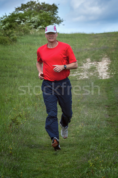 Young runner while training for a competition Stock photo © digoarpi