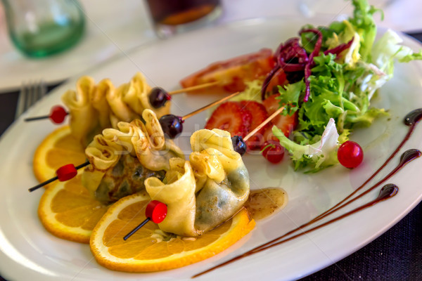 Pancake batter packs stuffed with spinach Stock photo © digoarpi
