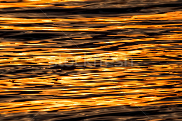 Tramonto acqua bella sole sfondo arancione Foto d'archivio © digoarpi