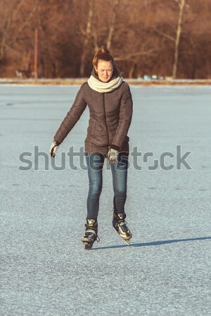 Young girl skating on Lake Balaton in Hungary Stock photo © digoarpi