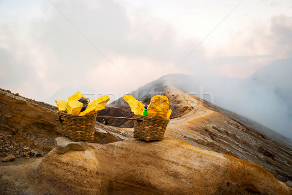 Baskets with sulphur at Kawah Ijen krater, Indonesia Stock photo © dinozzaver