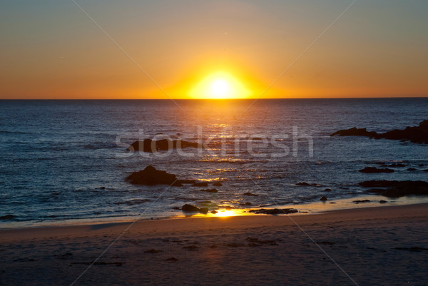 Sunset at ocean Stock photo © dinozzaver