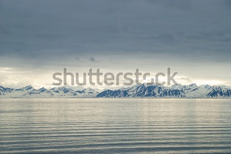 Snowy mountains by the ocean, Arctic Stock photo © dinozzaver