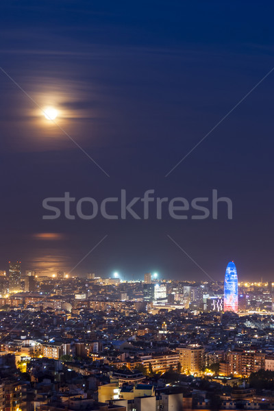 Barcelona at night with full moon, Spain Stock photo © dinozzaver