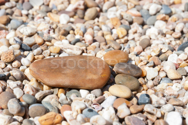 Stock photo: Stone foot on the stony beach