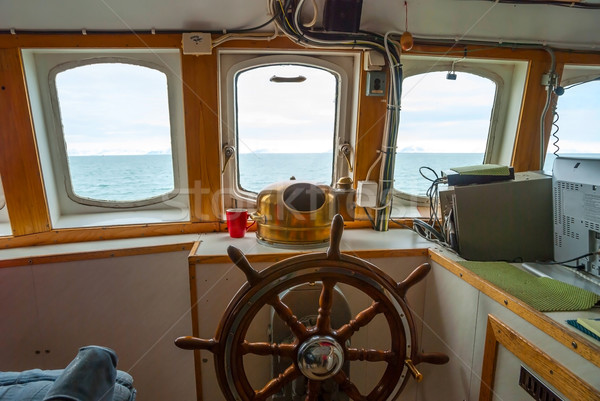 Stock photo: View trough capitan cabin with steering wheel on the boat