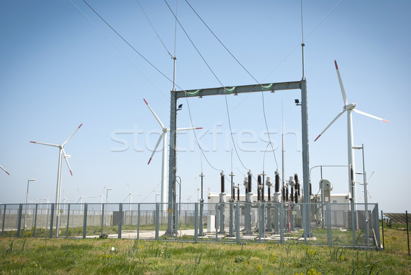 Power transformator between wind turbines Stock photo © dinozzaver