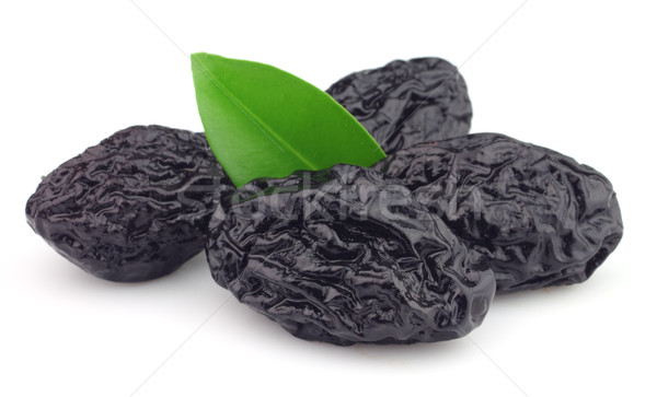 Dried prunes with leaves Stock photo © Dionisvera
