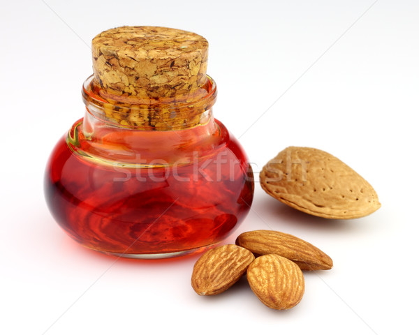 Almonds oil with kernel Stock photo © Dionisvera