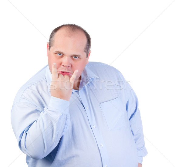 Fat Man in a Blue Shirt, Showing Obscene Gestures Stock photo © Discovod