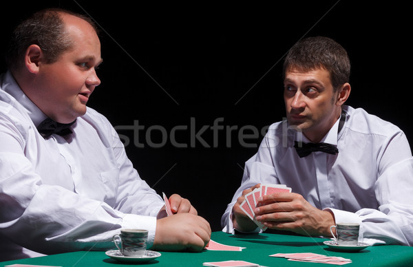 Two gentlemen in white shirts, playing cards Stock photo © Discovod
