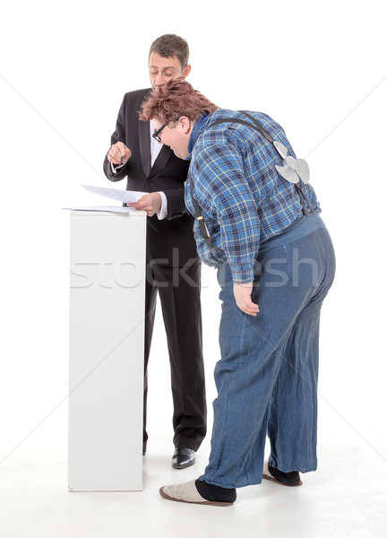 Elegant man arguing with a country yokel Stock photo © Discovod