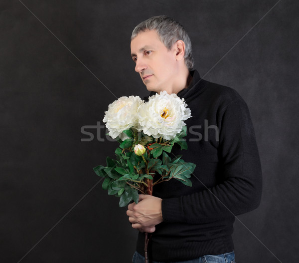 Man hiding a bouquet of flowers Stock photo © Discovod