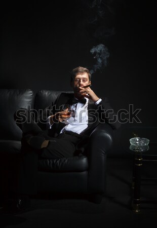 Stock photo: Sexy man in tuxedo waiting for his date