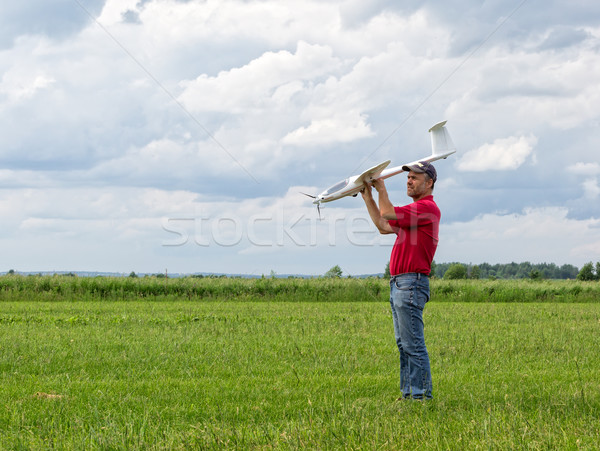 Stock photo: Man launches into the sky RC glider