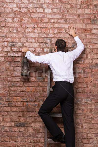 Man up against a brick wall Stock photo © Discovod