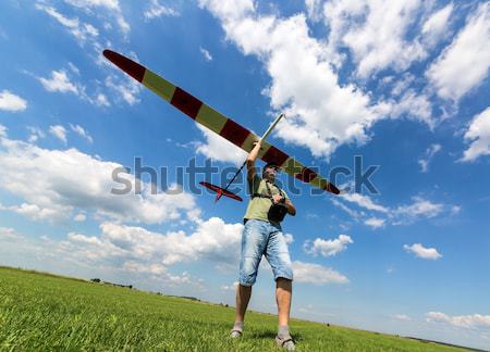 Man Launches into the Sky RC Glider Stock photo © Discovod