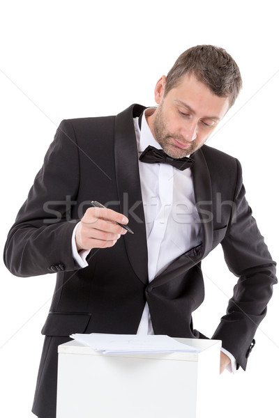 Man in a bow tie completing a form Stock photo © Discovod