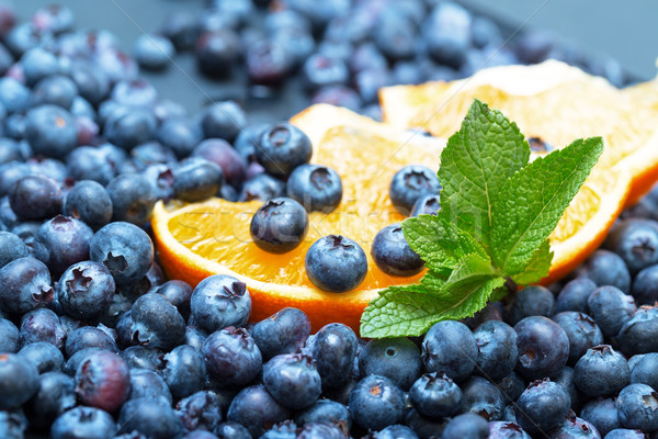 Freshly picked blueberries with orange Stock photo © Discovod