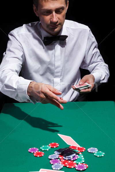 Gentleman in white shirt, playing cards Stock photo © Discovod