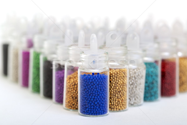 Small Glass Jars filled with Balls of Bead Stock photo © Discovod