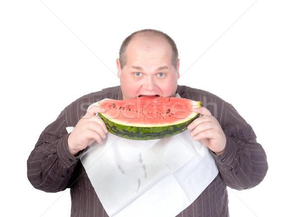 Otyły człowiek jedzenie arbuz około szyi Zdjęcia stock © Discovod