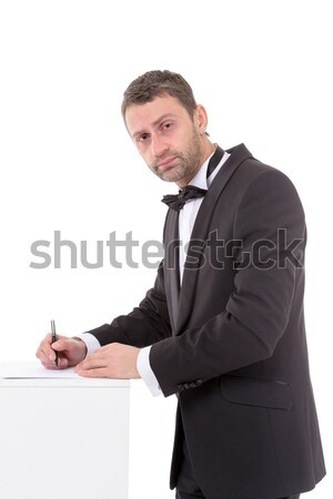 Man in a bow tie completing a form Stock photo © Discovod