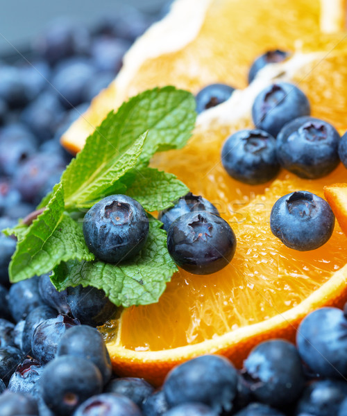 Freshly picked blueberries with orange Stock photo © Discovod