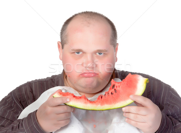 Obese man possessive of his food Stock photo © Discovod
