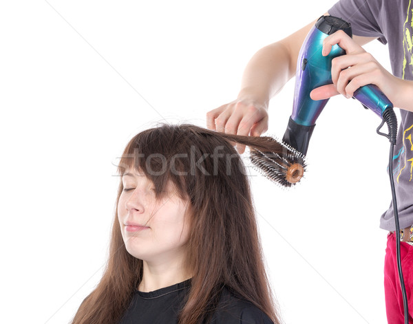 Woman enjoying having her hair blow dried Stock photo © Discovod