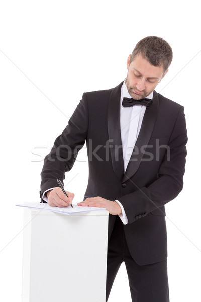 Man in a bow tie completing a form Stock photo © Discovod