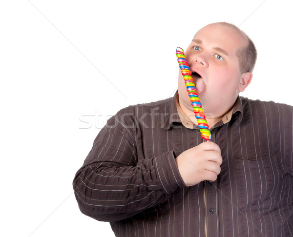 Fat man enjoying a lollipop Stock photo © Discovod