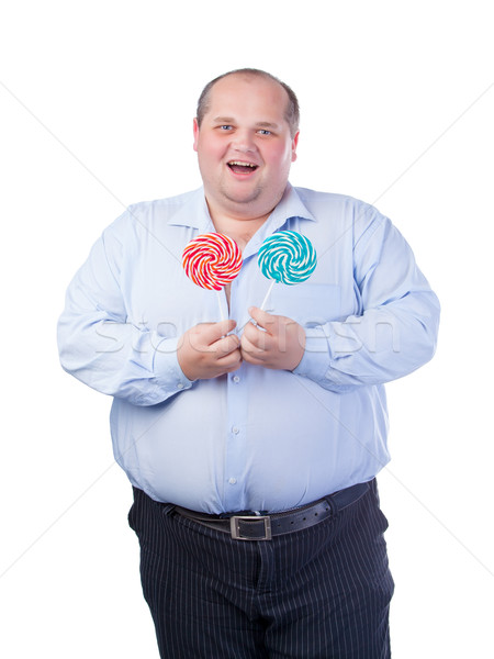 Fat Man in a Blue Shirt, Eating a Lollipop Stock photo © Discovod