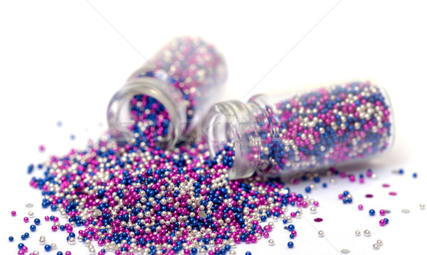 Small Glass Jars filled with Multicolored Balls of Bead Stock photo © Discovod