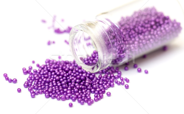 Stock photo: Small Glass Jar filled with Pink Balls of Bead
