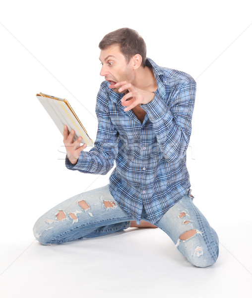 Man communicates via tablet pad Stock photo © Discovod