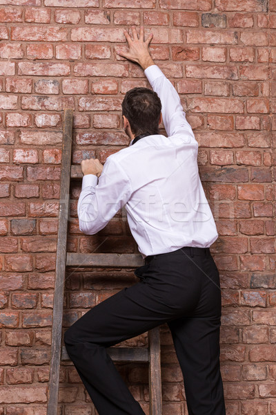 Man up against a brick wall Stock photo © Discovod