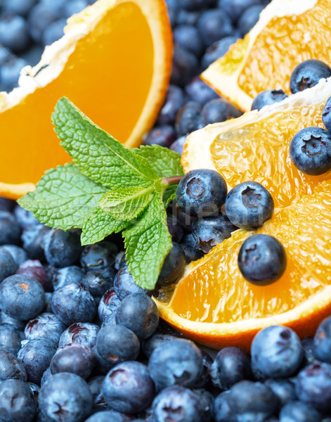 Freshly picked blueberries with orange Stock photo © Discovod