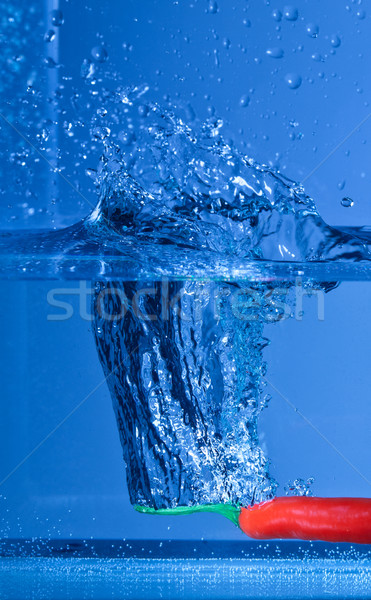 Roşu piper albastru fundal val Imagine de stoc © Discovod