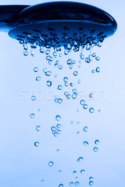 Pommeau de douche courir eau fond bleu [[stock_photo]] © Discovod
