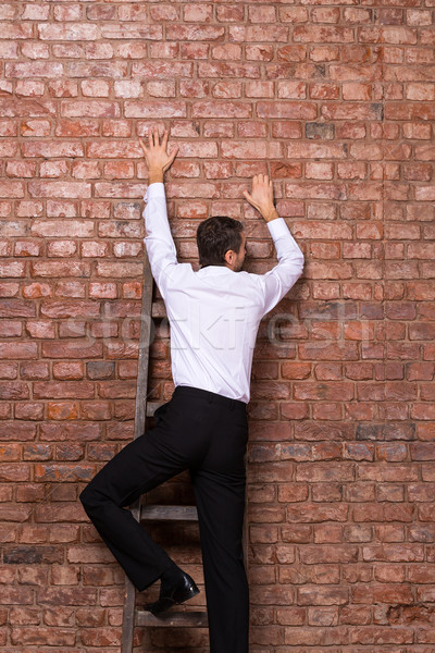 Man up against a brick wall Stock photo © Discovod