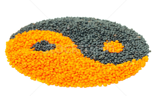 Orange and Black Lentil forming a yin yang symbol Stock photo © Discovod